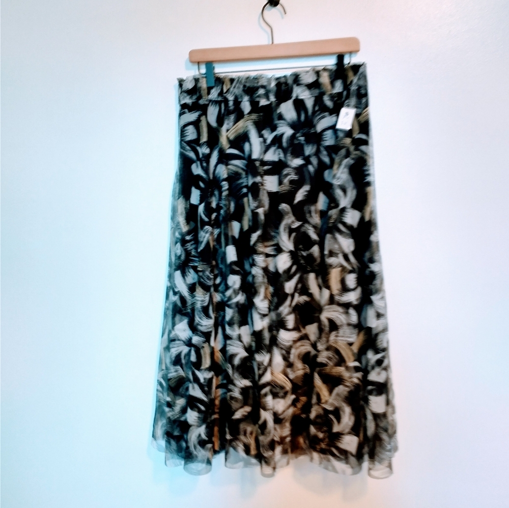 Cato floral cottagecore printed tulle skirt with elastic waistband. Midi length